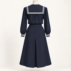 AI back preview of the navy sailor set with square striped collar and one center-back inverted skirt pleat