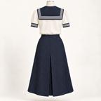 AI back preview of the ivory short-sleeve sailor blouse and navy skirt with square collar and center inverted pleat