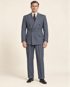 AI design preview: slate blue-grey six-button double-breasted suit with peaked lapels and cuffed trousers, front