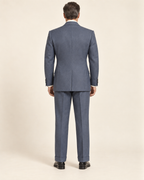 AI design preview: blue-grey suit back with center vent and straight cuffed trousers