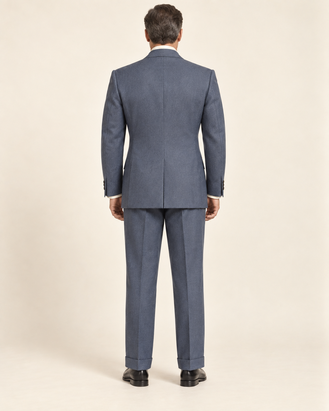 AI design preview: blue-grey suit back with center vent and straight cuffed trousers