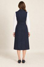 Back view of tailored vest dress design on a model