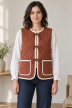 Front design preview of women's reversible quilted vest.