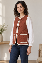 Three-quarter design preview of women's reversible quilted vest.