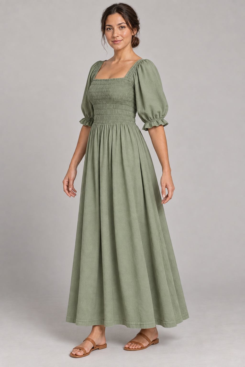 AI design preview: three-quarter view of the sage shirred-bodice maxi dress showing the side shirring, ruffled sleeve cuffs and plain long skirt