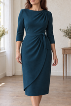 Close view of shoulder pleats, left waist gathers and curved overlay above the complete slim base skirt