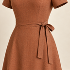 AI concept detail of cinnamon dress side waist bow over a continuous closed front