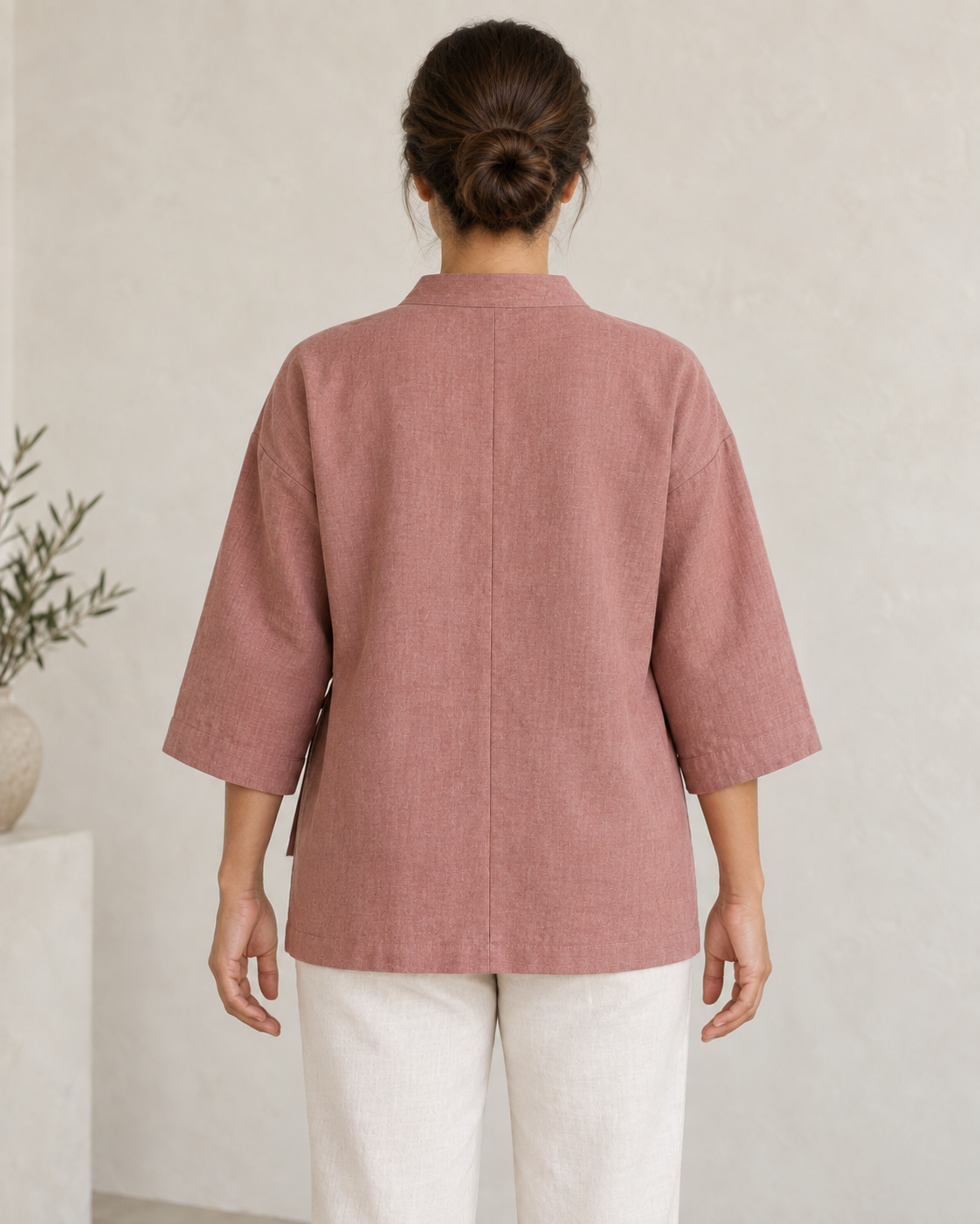 AI design preview: rear of the same rose lounge jacket, showing center-back seam, dropped shoulders and wide sleeves