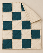 Design preview: same twenty-block rag quilt with a corner folded to show the planned cream reverse and smooth joined grid