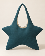 AI design preview: front of a teal star-shaped hobo bag with four pointed body lobes, deep U opening and single fixed fabric loop