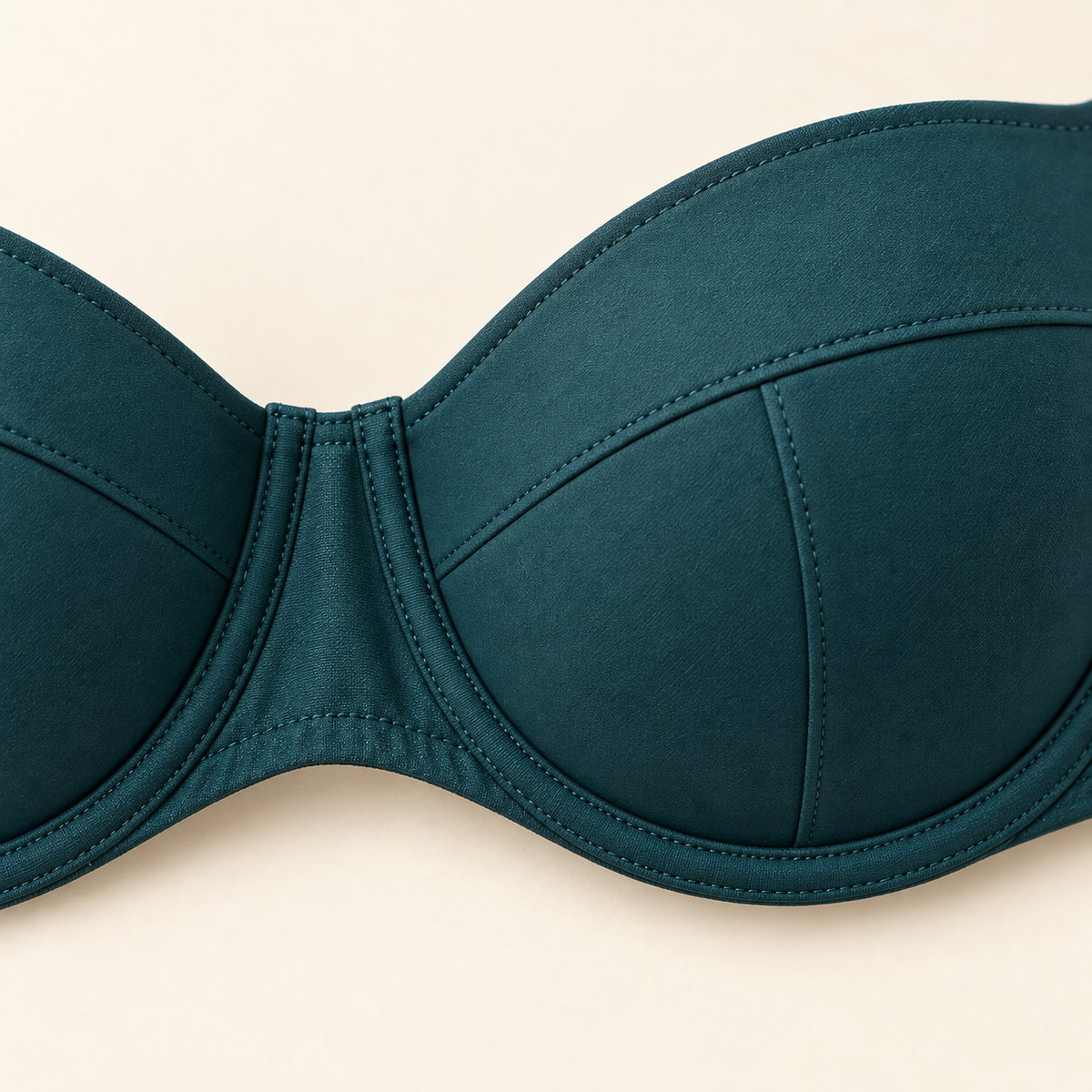 AI concept close-up of teal balconette cup seams, centre gore and stitched underwire channel