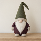 AI design preview: plum decorative gnome with moss cone hat, oatmeal hands and feet, fabric nose and ivory beard, front view