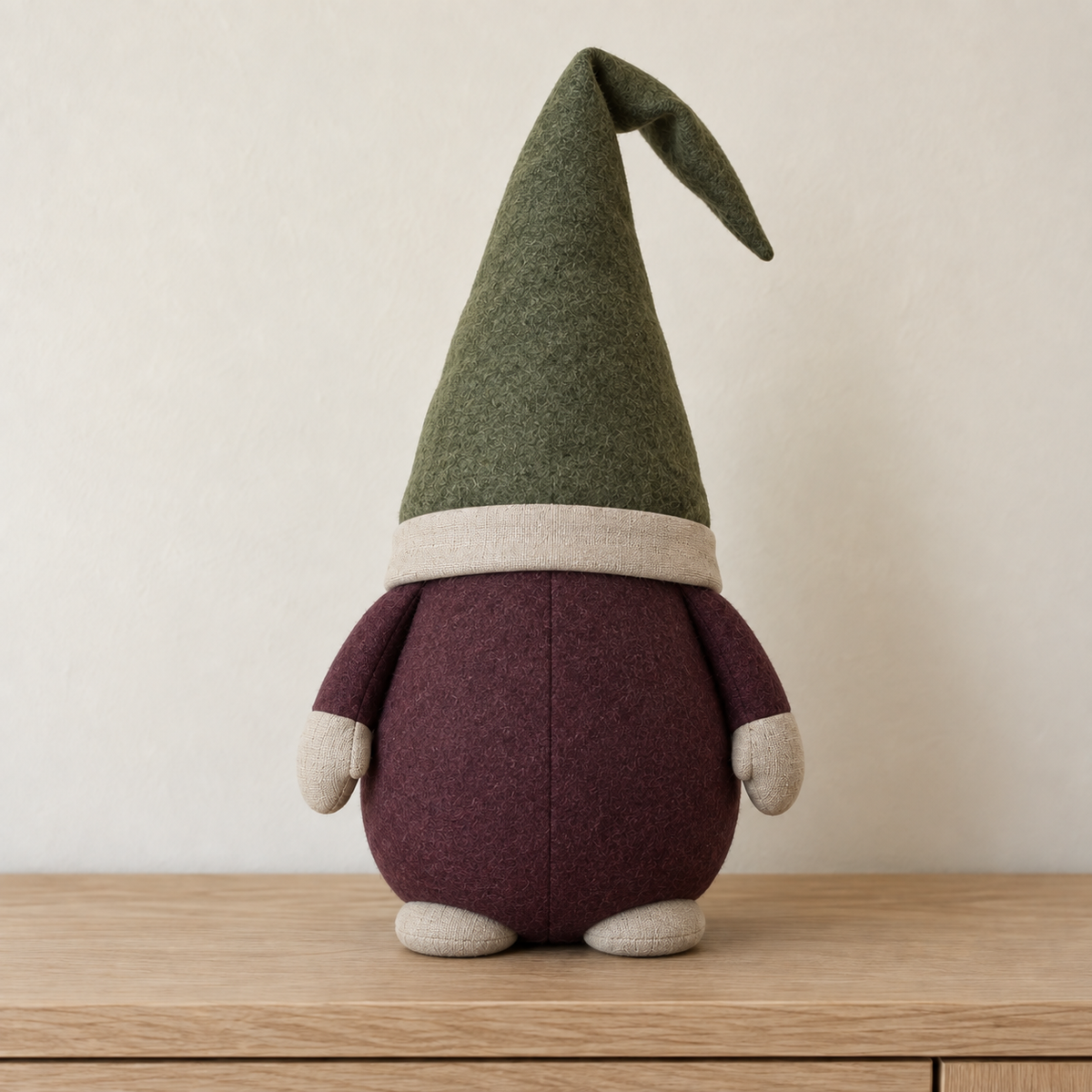 AI design preview: plain rear and center seam of the same plum and moss stuffed display gnome