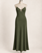AI preview: deep-olive color option of the same long tied-keyhole slip dress with light oat edging.