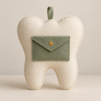 Ivory felt tooth fairy pillow with a sage envelope pocket, embroidered ochre star and hanging loop