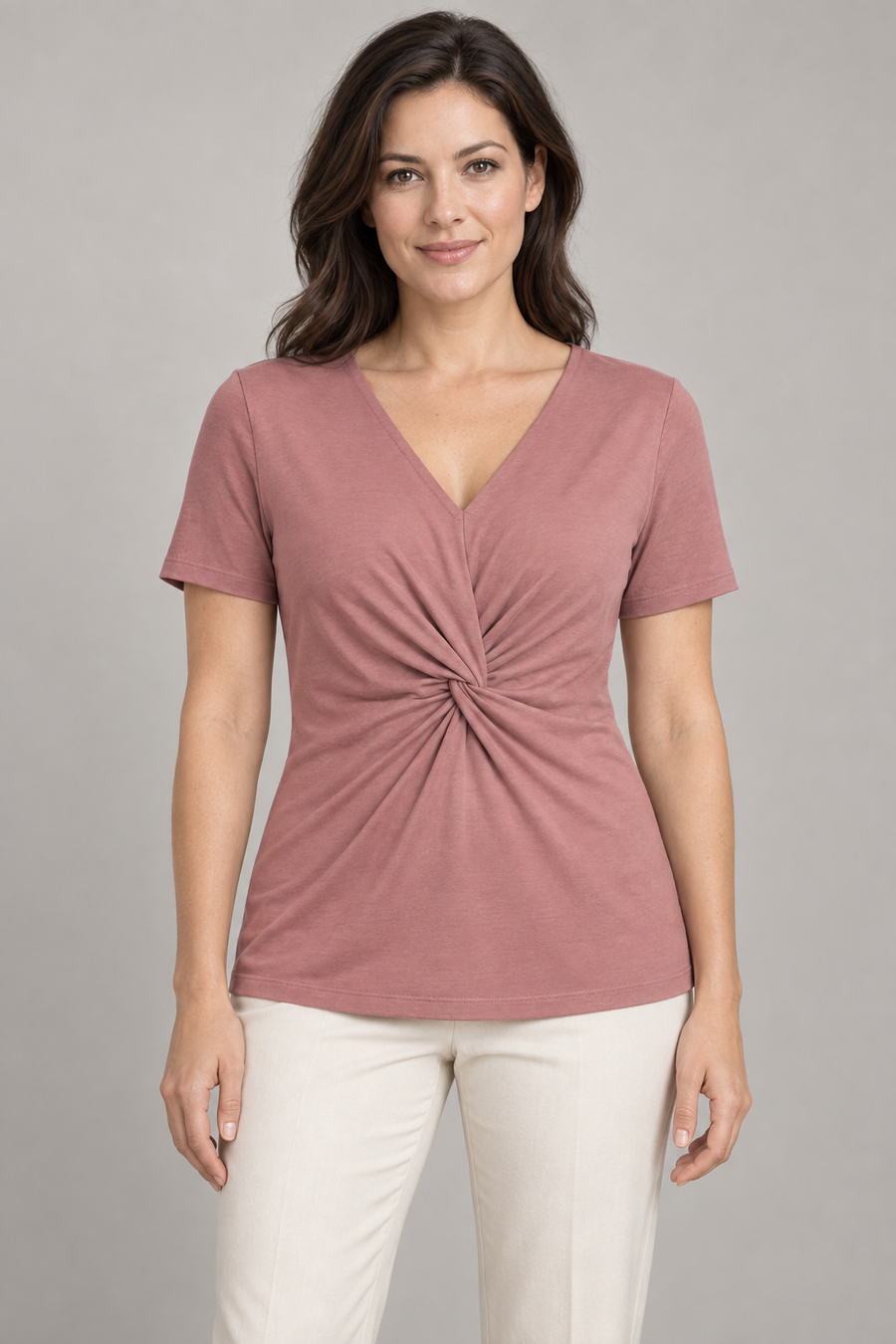 Front design preview of a dusty rose jersey top with an integral waist twist, short sleeves and covered hip-length hem.