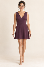 AI design preview: plum mini-length view of the same woven V-neck dress with broad fabric shoulders