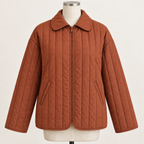 AI design preview: rust-copper color of the same zip-front quilted jacket with turnover collar, slanted welt pockets and tonal binding